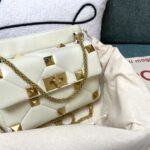 valentino white valentino garavani roman stud medium napa sheep leather big nail bag